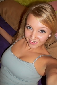 Blonde girlfriend takes selfshot pictures in bed of her perky teenage tits